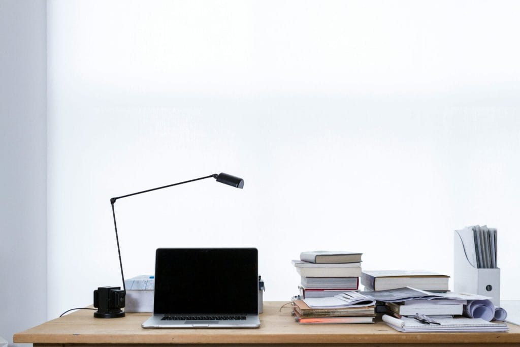 mac book pro on top of table